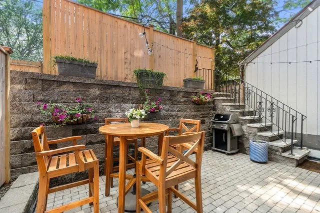 a view of an outdoor sitting area with furniture