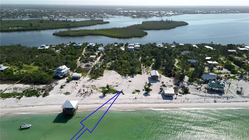 8156 Little Gasparilla Boca Grande, FL 33921 - Photo 2 of 25 a view of a lake with outdoor space