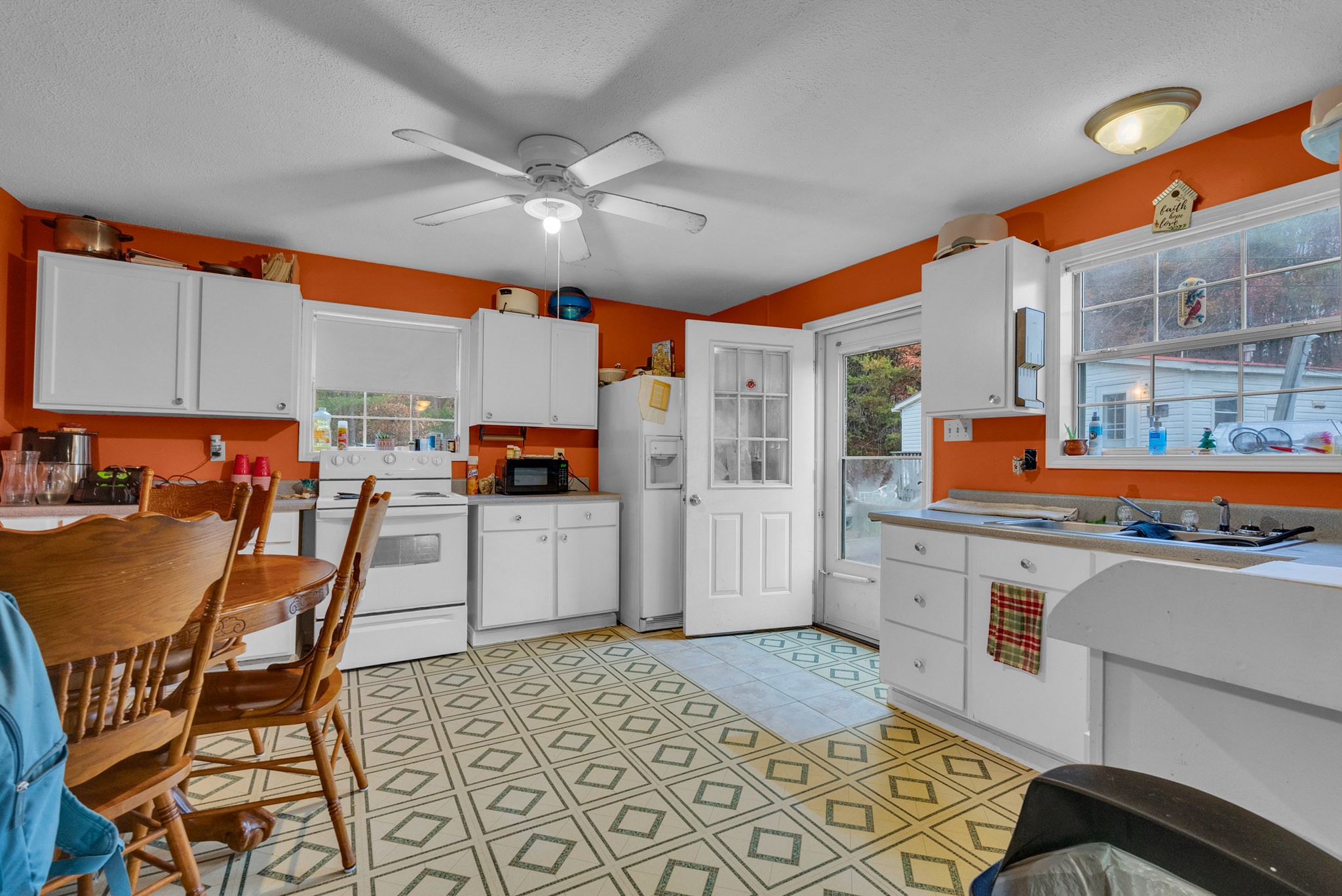 164 Glenn Lane Spring City, TN 37381 - Photo 11 of 33 a dining hall with stainless steel appliances kitchen island granite countertop a table and chairs