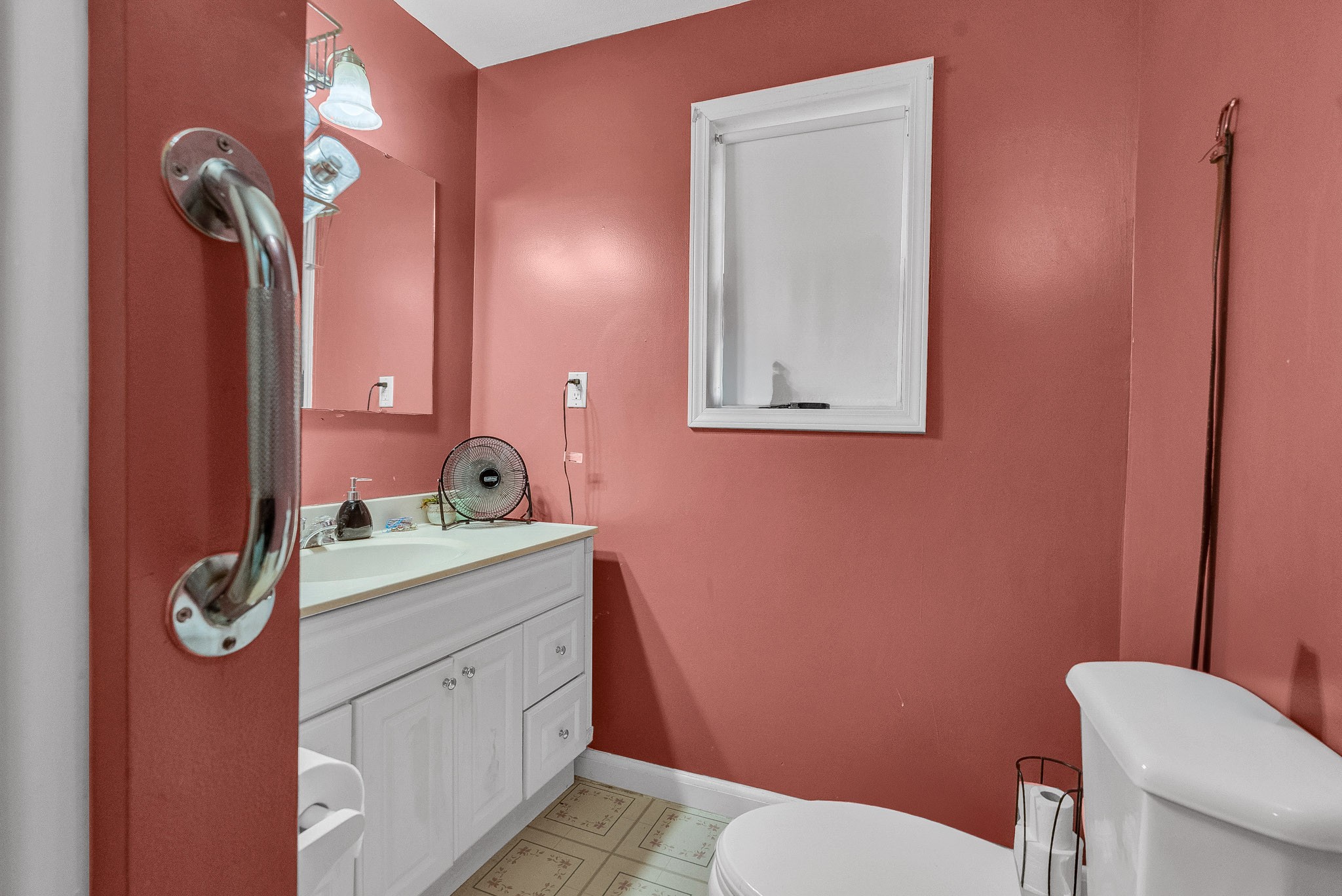 164 Glenn Lane Spring City, TN 37381 - Photo 17 of 33 a bathroom with a toilet sink vanity and mirror
