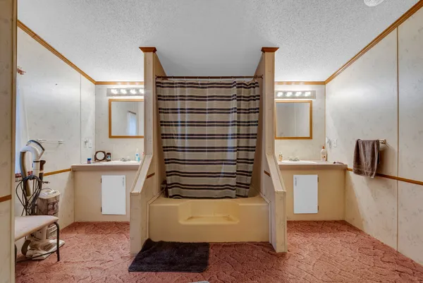 a bathroom with a bathtub and a sink