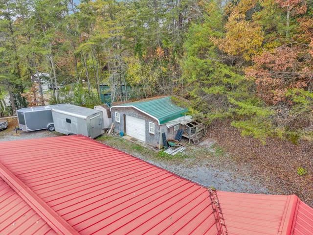a view of a house with a yard and sitting area