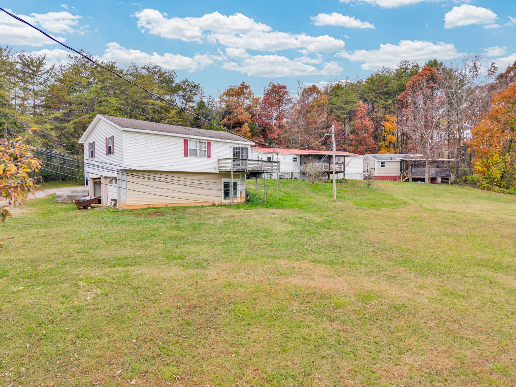 164 Glenn Lane Spring City, TN 37381 - Photo 32 of 33 a house view with swimming pool and trees in the background