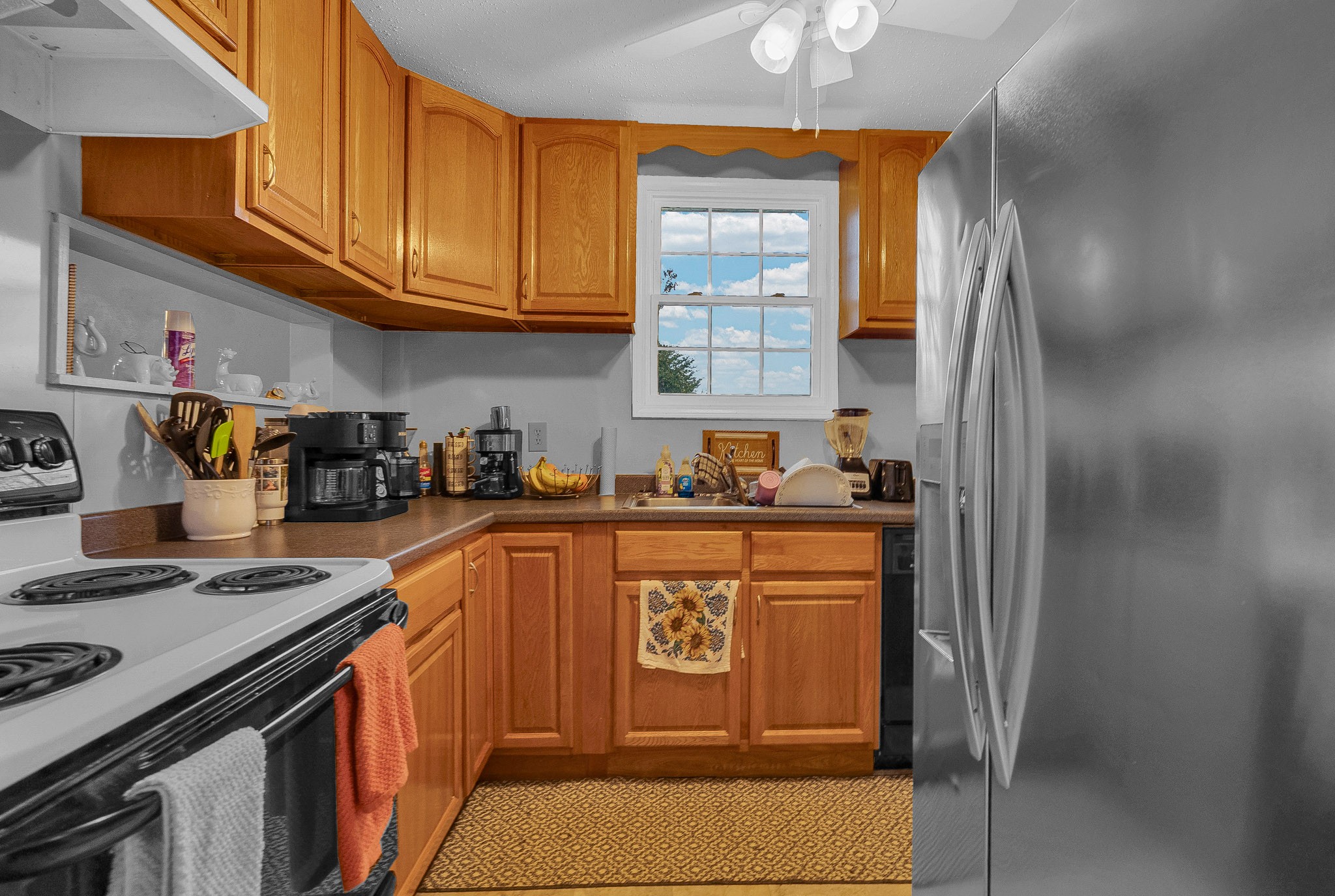 164 Glenn Lane Spring City, TN 37381 - Photo 4 of 33 a kitchen with stainless steel appliances granite countertop a refrigerator and a stove top oven