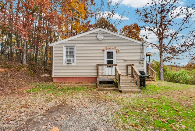 a view of a backyard with a sitting area
