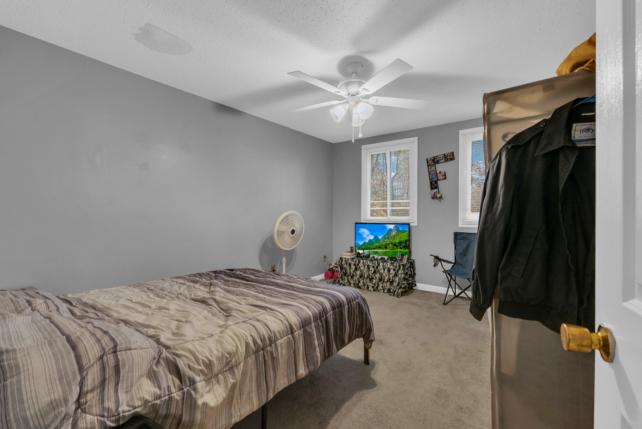 164 Glenn Lane Spring City, TN 37381 - Photo 5 of 33 a bedroom with a bed table and a window