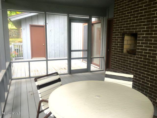 187 Old Stockbridge Road Lenox, MA 01240 - Photo 35 of 37 Screened porch fireplace