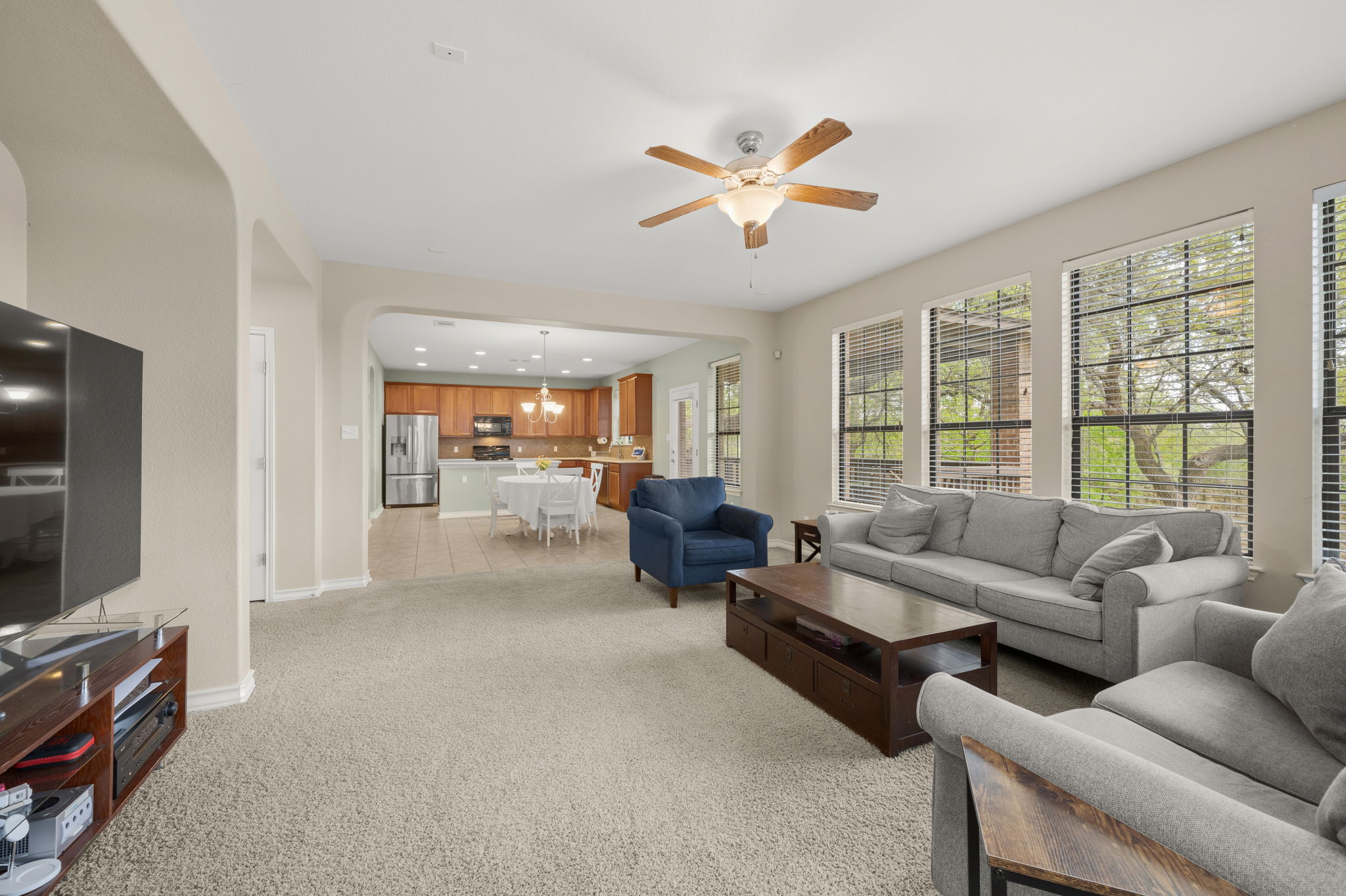 7629 Brecourt Manor Way Austin, TX 78739 - Photo 11 of 40 a living room with furniture and a flat screen tv