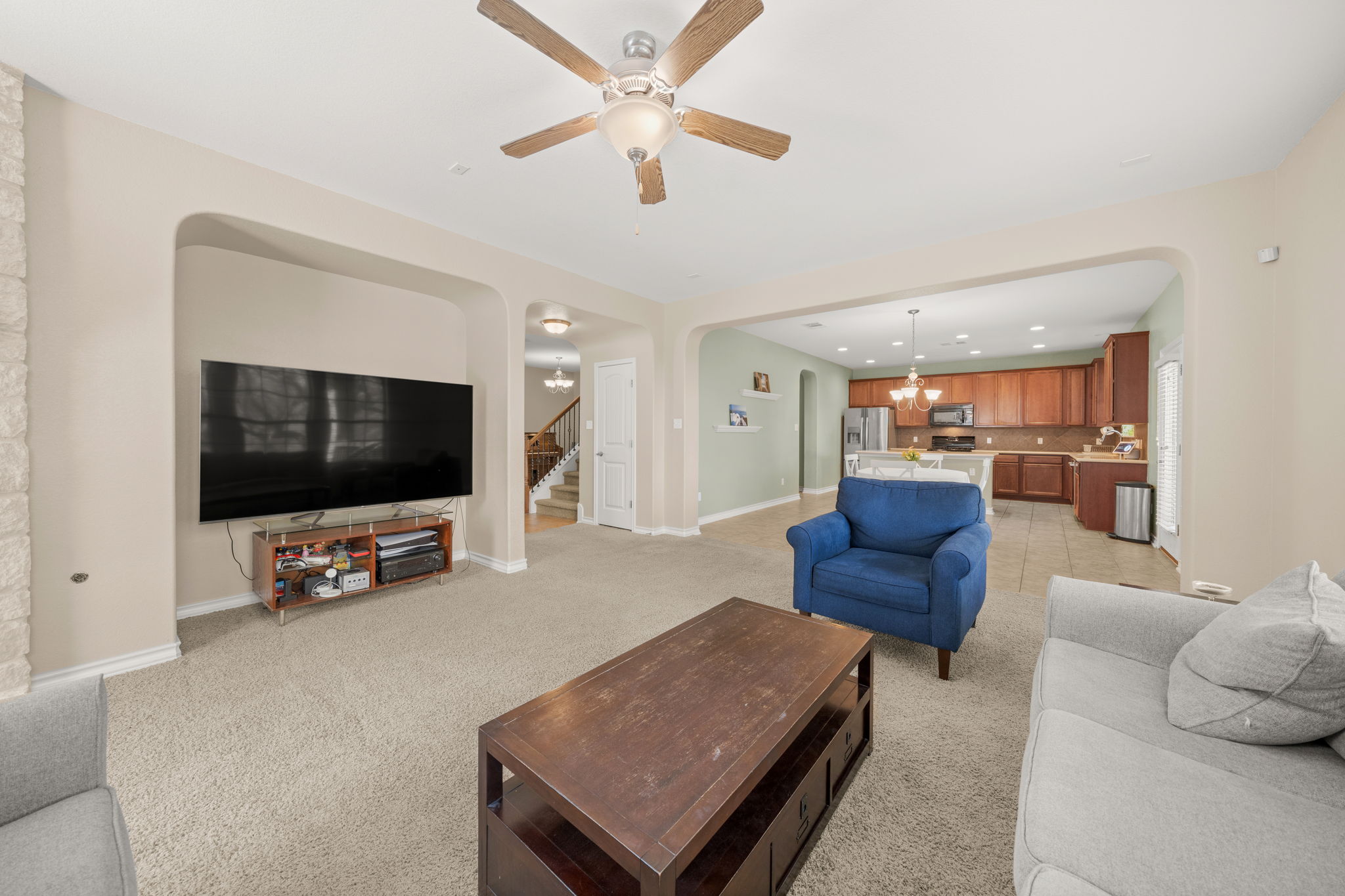 7629 Brecourt Manor Way Austin, TX 78739 - Photo 12 of 40 a living room with furniture and a flat screen tv