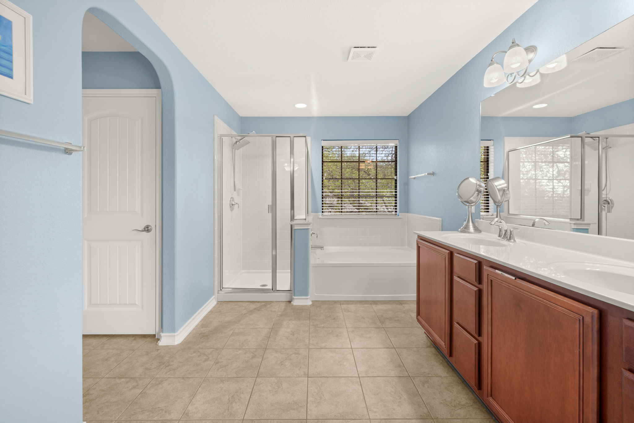 7629 Brecourt Manor Way Austin, TX 78739 - Photo 20 of 40 a spacious bathroom with a tub sink shower and mirror