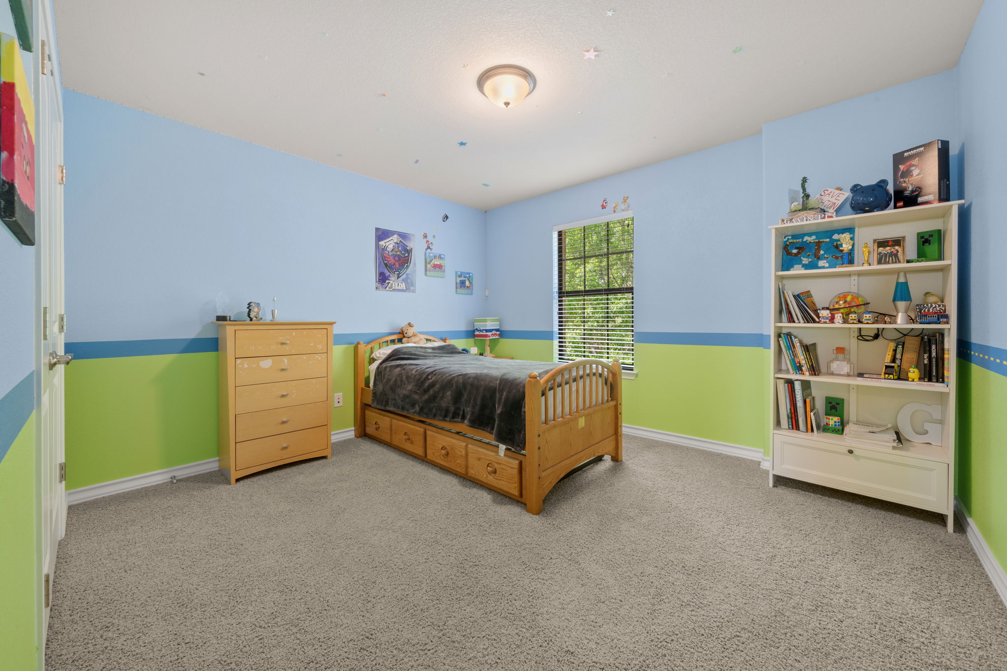 7629 Brecourt Manor Way Austin, TX 78739 - Photo 24 of 40 a bedroom with a bed and a window