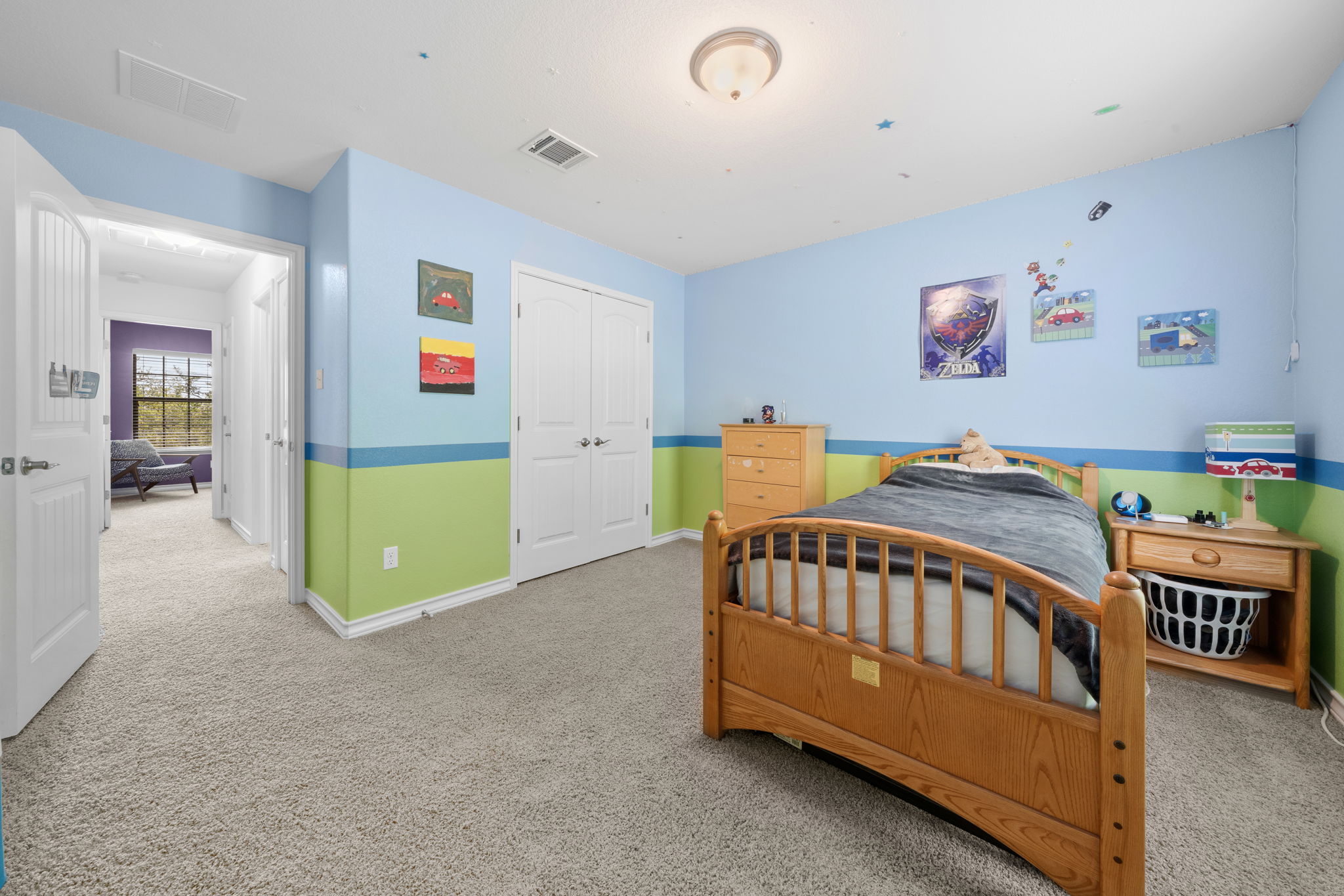 7629 Brecourt Manor Way Austin, TX 78739 - Photo 25 of 40 a bedroom with a bed and wooden floor