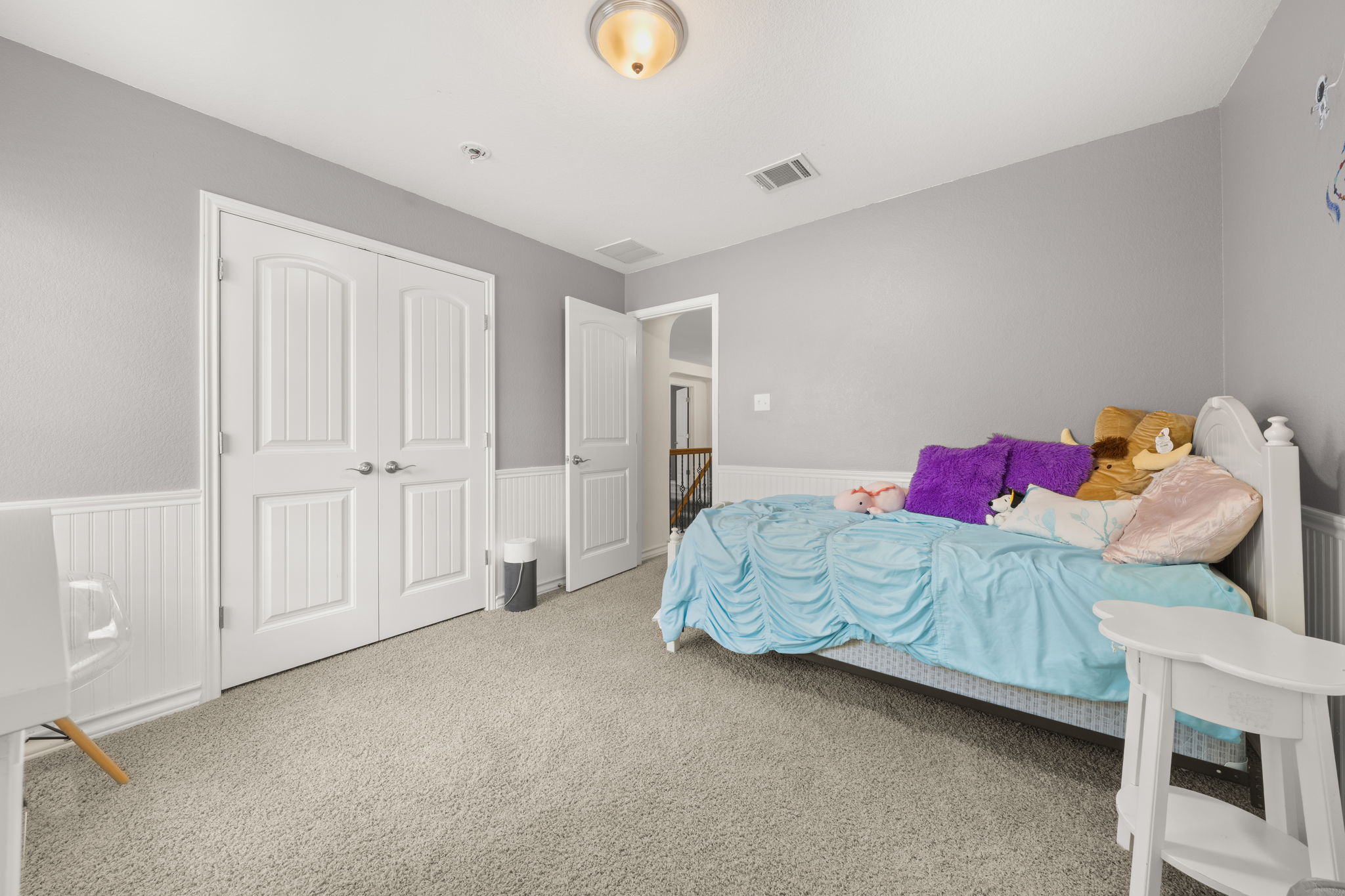 7629 Brecourt Manor Way Austin, TX 78739 - Photo 27 of 40 a bedroom with a bed and a cabinets