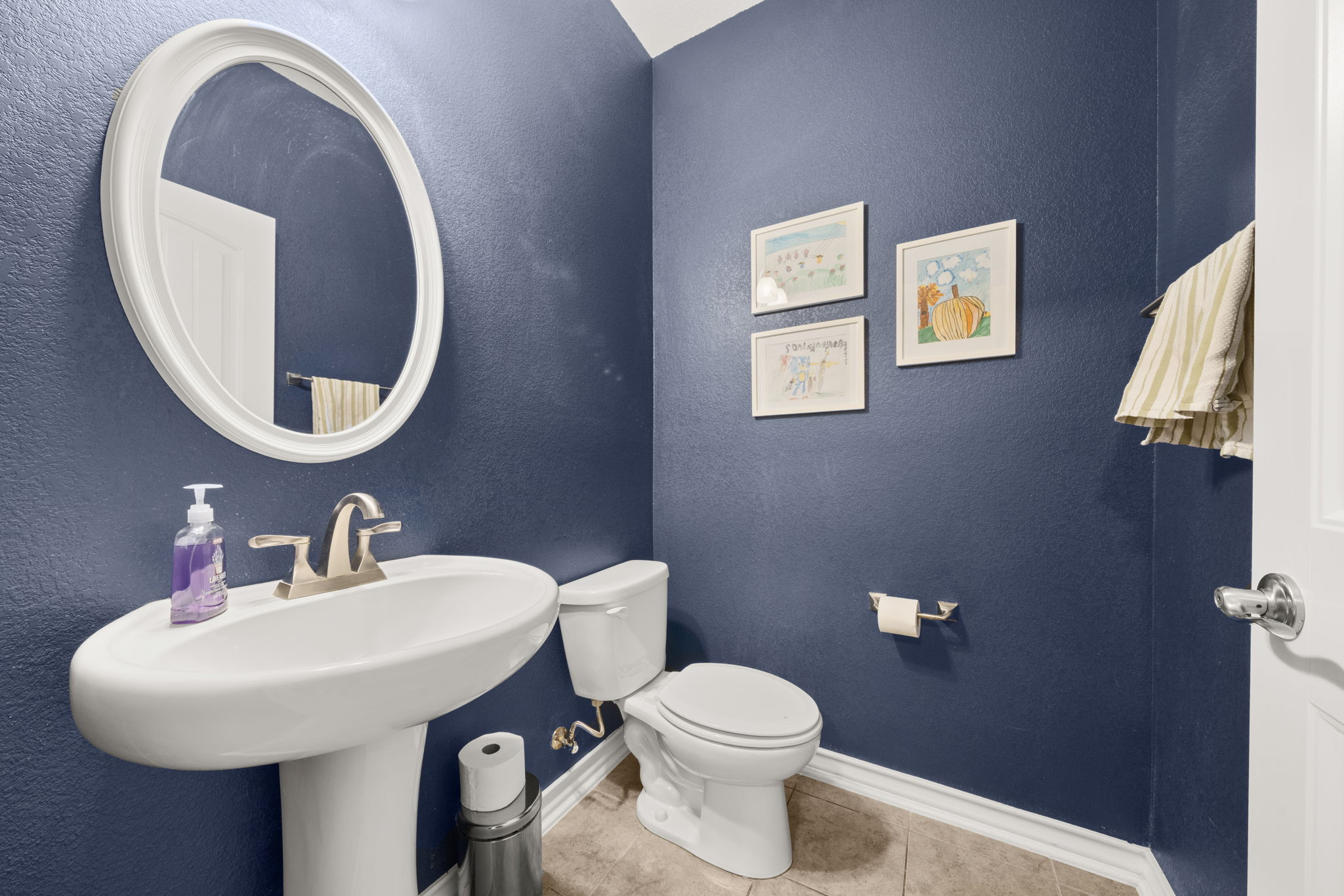 7629 Brecourt Manor Way Austin, TX 78739 - Photo 32 of 40 a bathroom with a toilet sink and mirror