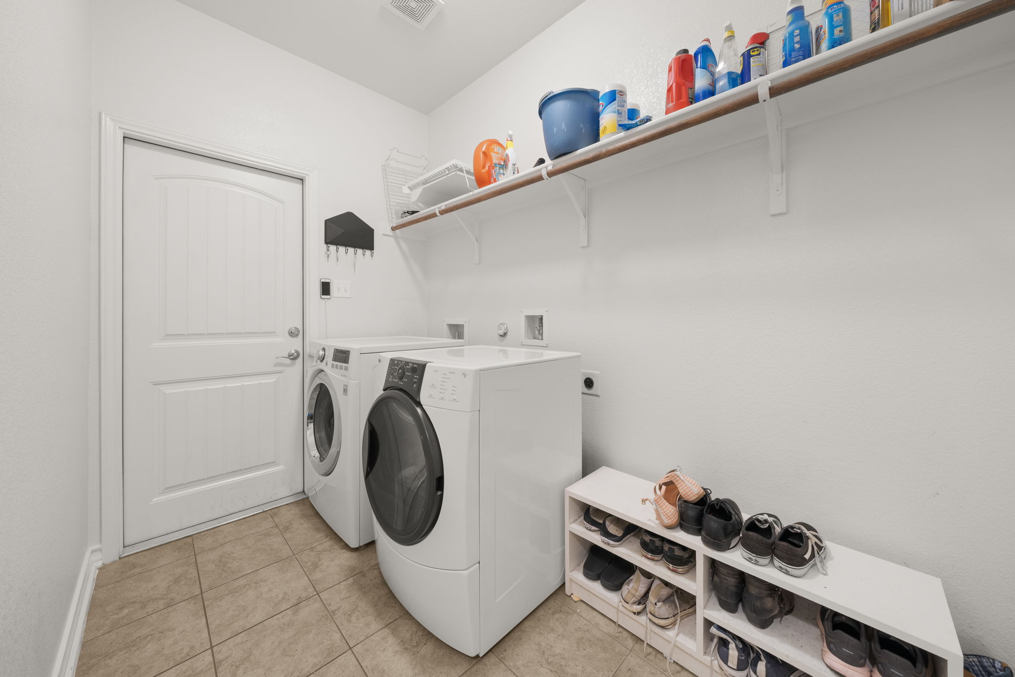 7629 Brecourt Manor Way Austin, TX 78739 - Photo 33 of 40 a utility room with dryer and washer