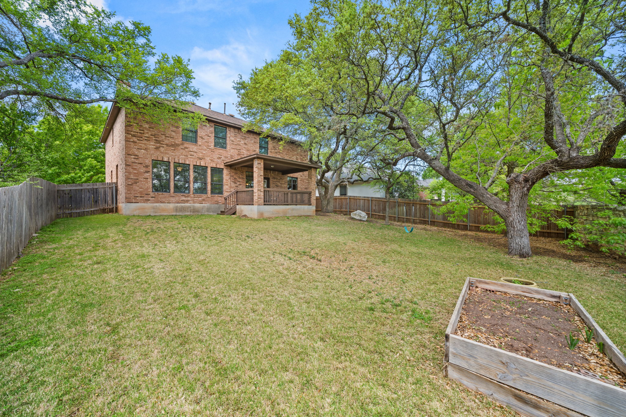 7629 Brecourt Manor Way Austin, TX 78739 - Photo 36 of 40 front view of a house with a yard