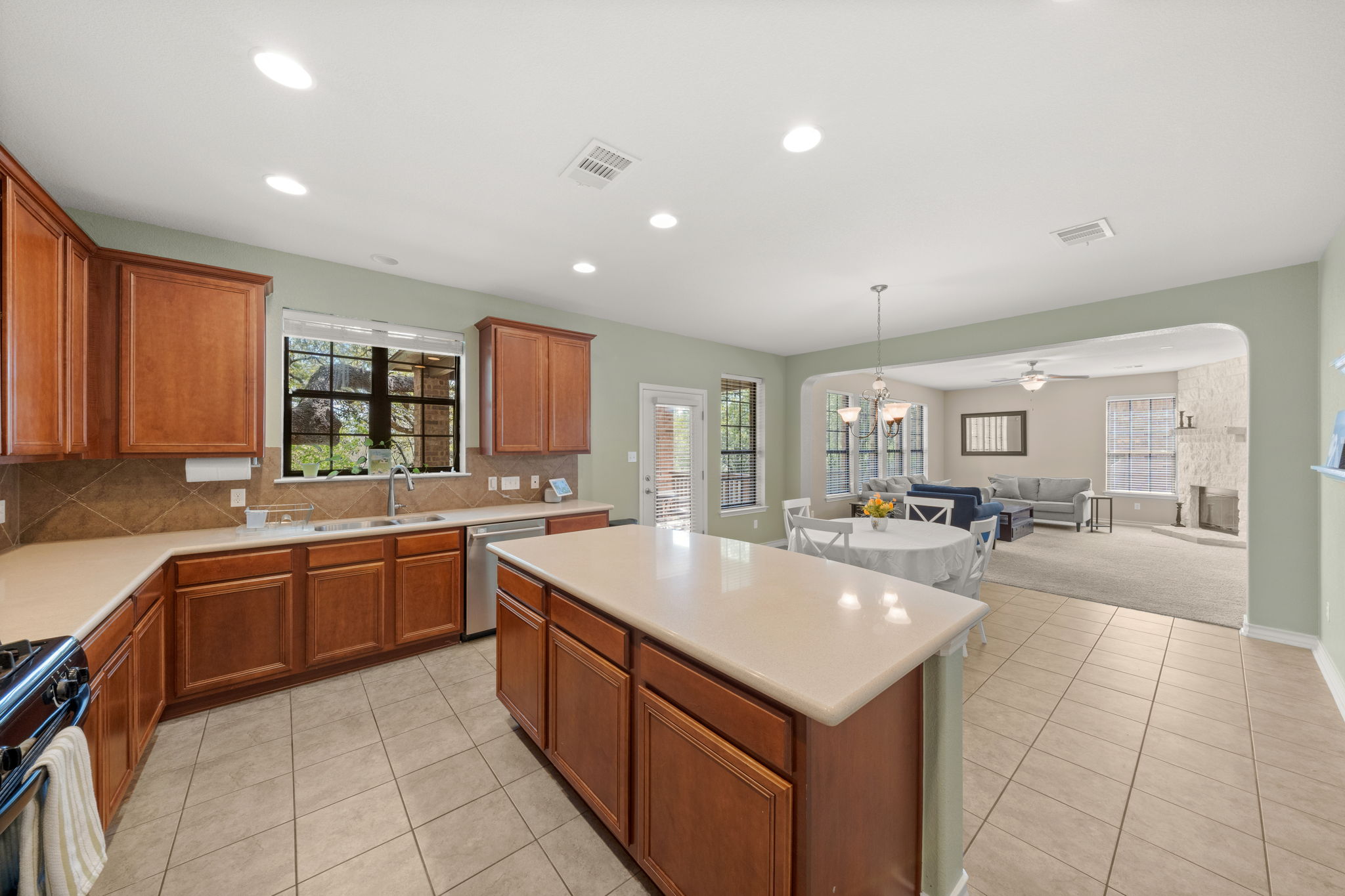 7629 Brecourt Manor Way Austin, TX 78739 - Photo 5 of 40 a large kitchen with stainless steel appliances lots of counter top space