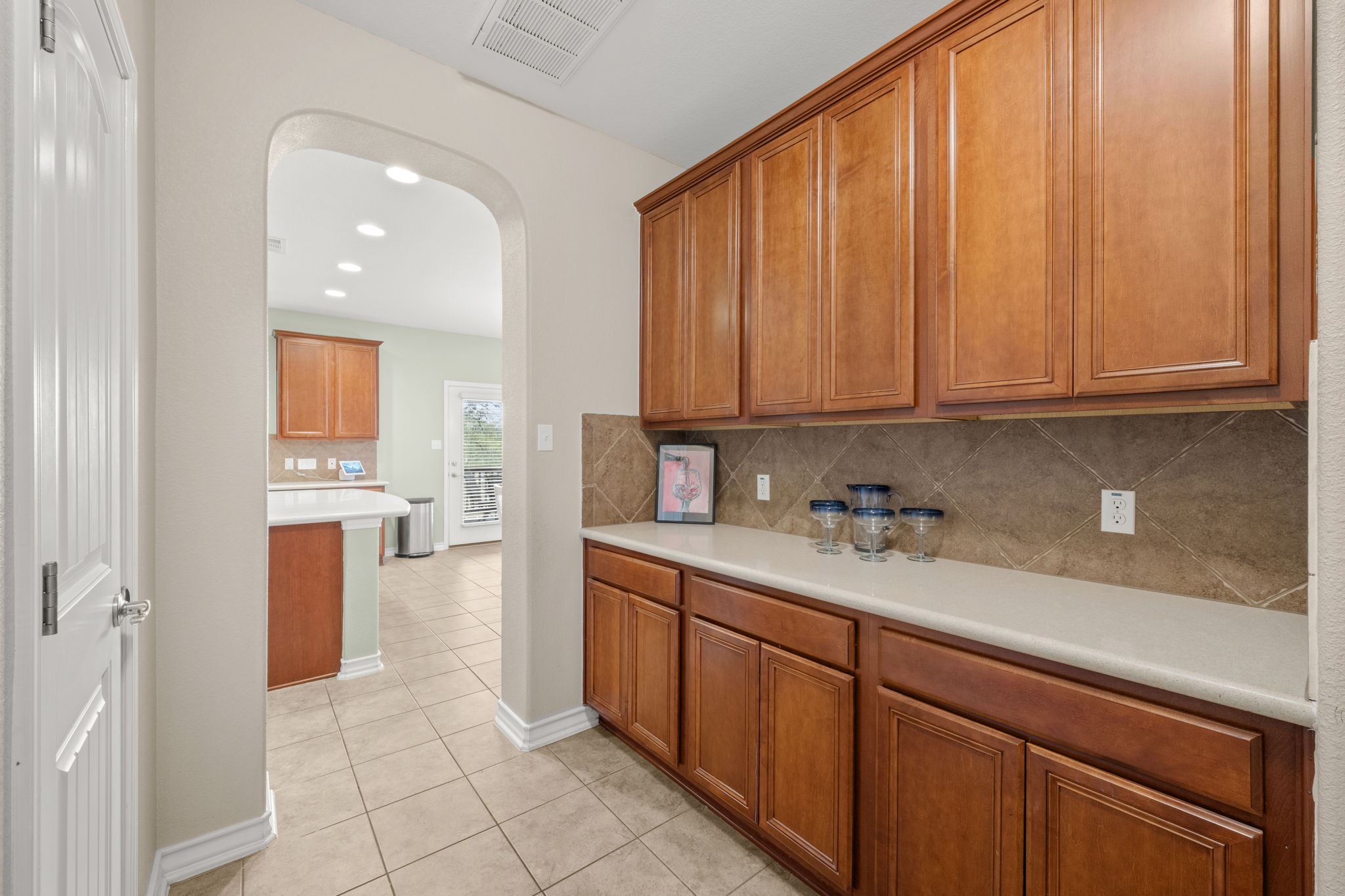 7629 Brecourt Manor Way Austin, TX 78739 - Photo 7 of 40 a kitchen with stainless steel appliances granite countertop a refrigerator and sink