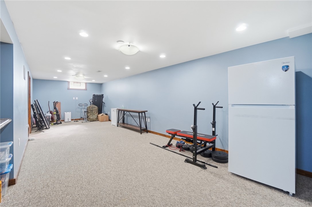 1325 Chelsea Road Troy, OH 45373 - Photo 29 of 42 This spacious lower level offers versatile living space with plush carpeting and modern lighting.