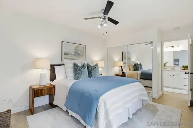 a bedroom with bed and window