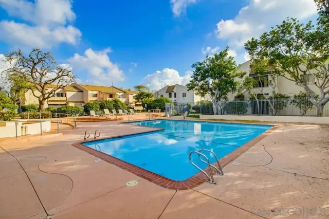 a view of swimming pool with seating space