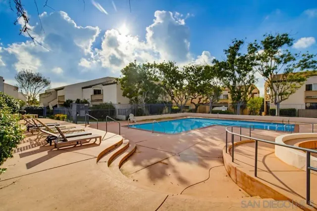a view of swimming pool with outdoor seating