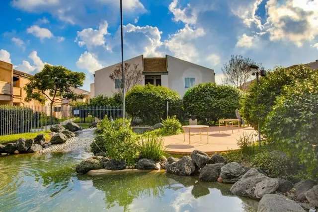 a balcony with table and chairs