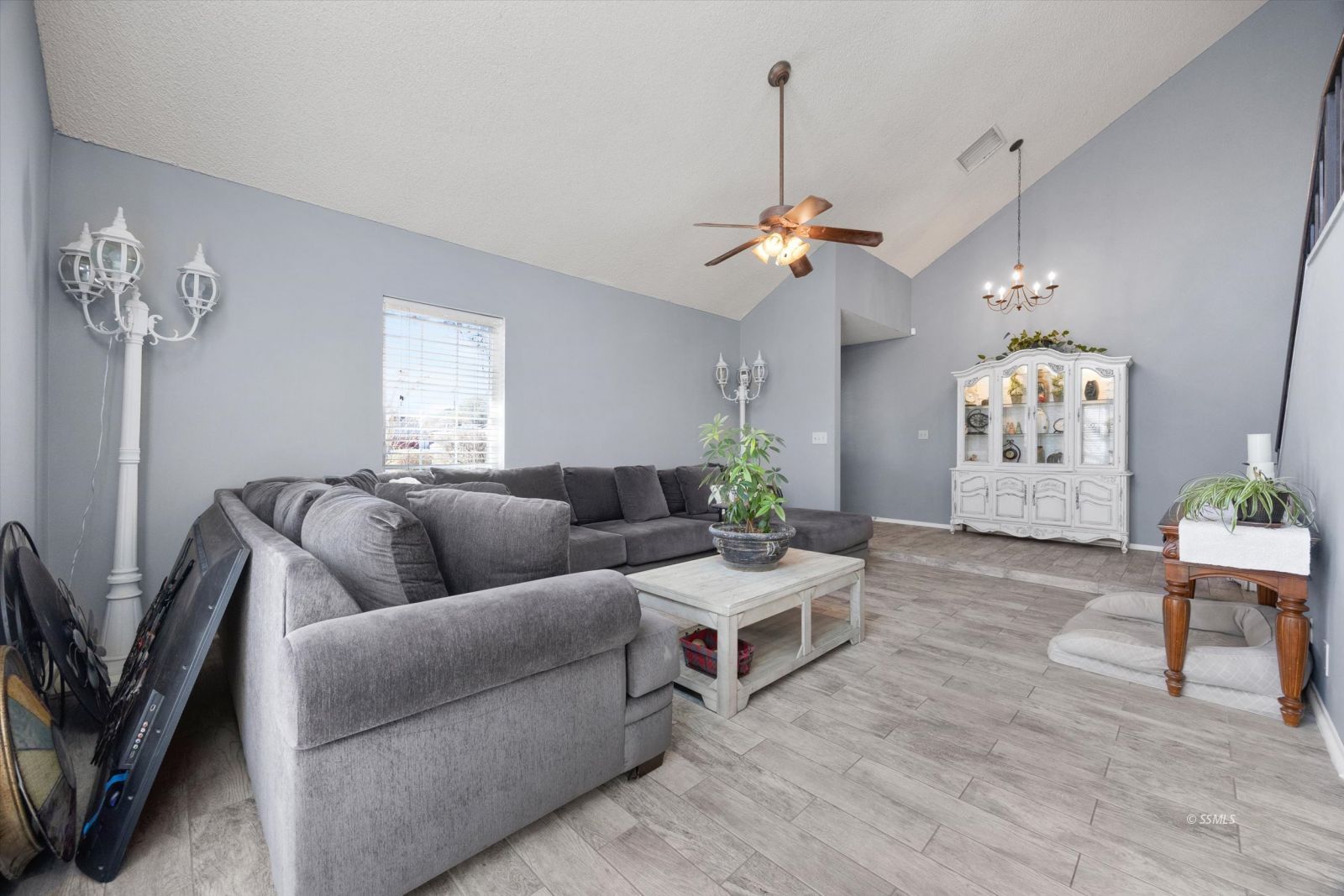 736 Fendrick Circle Ridgecrest, CA 93555 - Photo 7 of 49 a living room with furniture a chandelier and a window