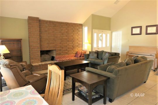 908 Randall Street Ridgecrest, CA 93555 - Photo 5 of 35 a living room with furniture and a fireplace