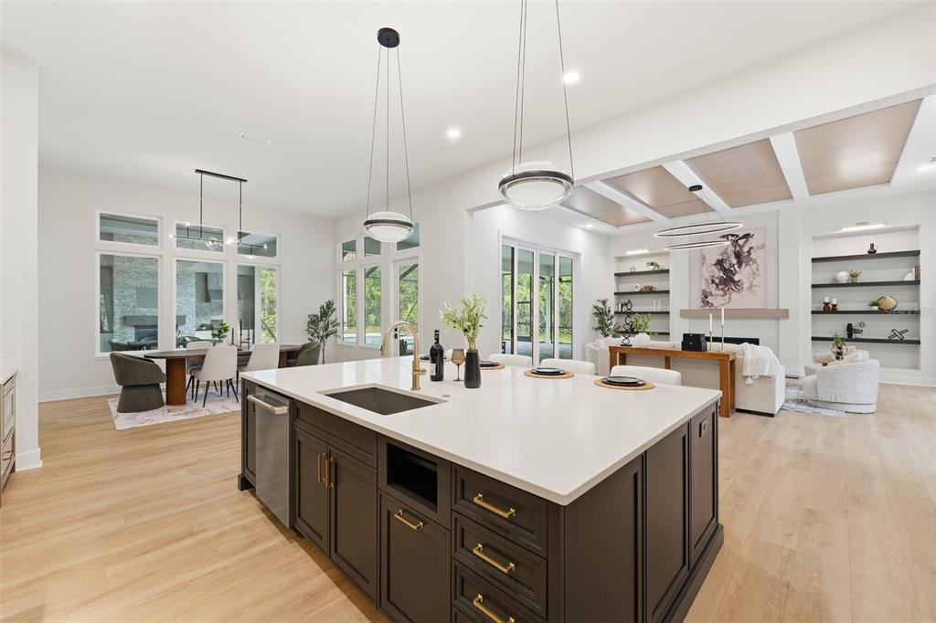 5995 Southwest 124th Way Archer, FL 32618 - Photo 11 of 33 a kitchen with a stove a refrigerator a sink dishwasher with a dining table and chairs