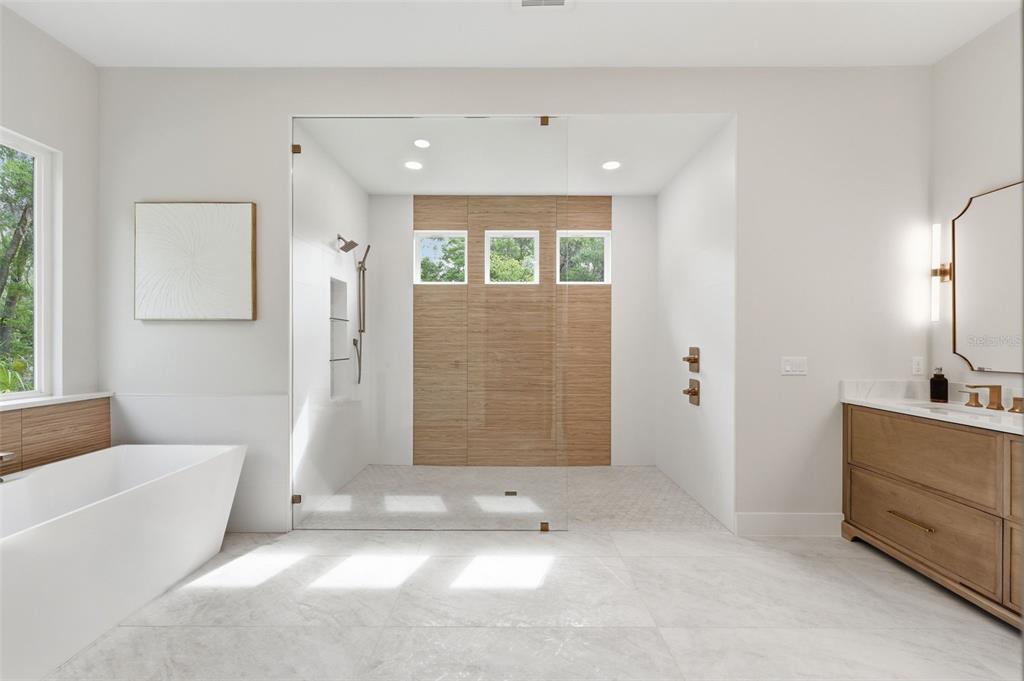 5995 Southwest 124th Way Archer, FL 32618 - Photo 17 of 33 a bathroom with a tub shower and sink