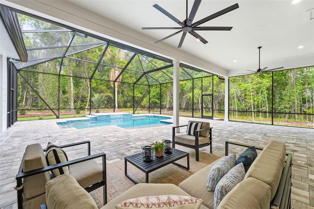 5995 Southwest 124th Way Archer, FL 32618 - Photo 25 of 33 a living room with furniture and a floor to ceiling windows