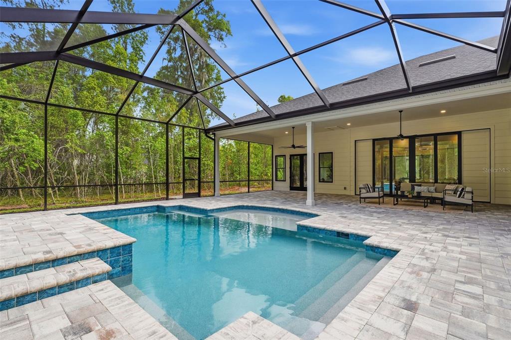 5995 Southwest 124th Way Archer, FL 32618 - Photo 28 of 33 a swimming pool with outdoor seating