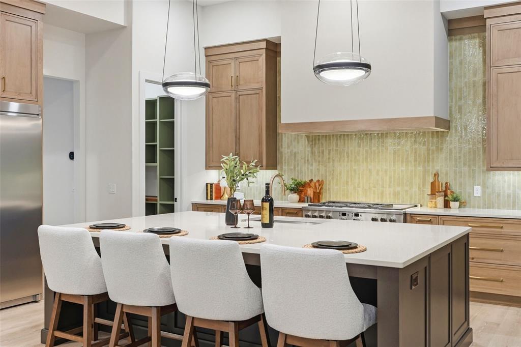 5995 Southwest 124th Way Archer, FL 32618 - Photo 9 of 33 a kitchen with a dining table chairs and white cabinets