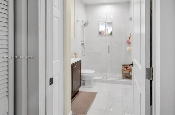a bed room with a bed window and a potted plant
