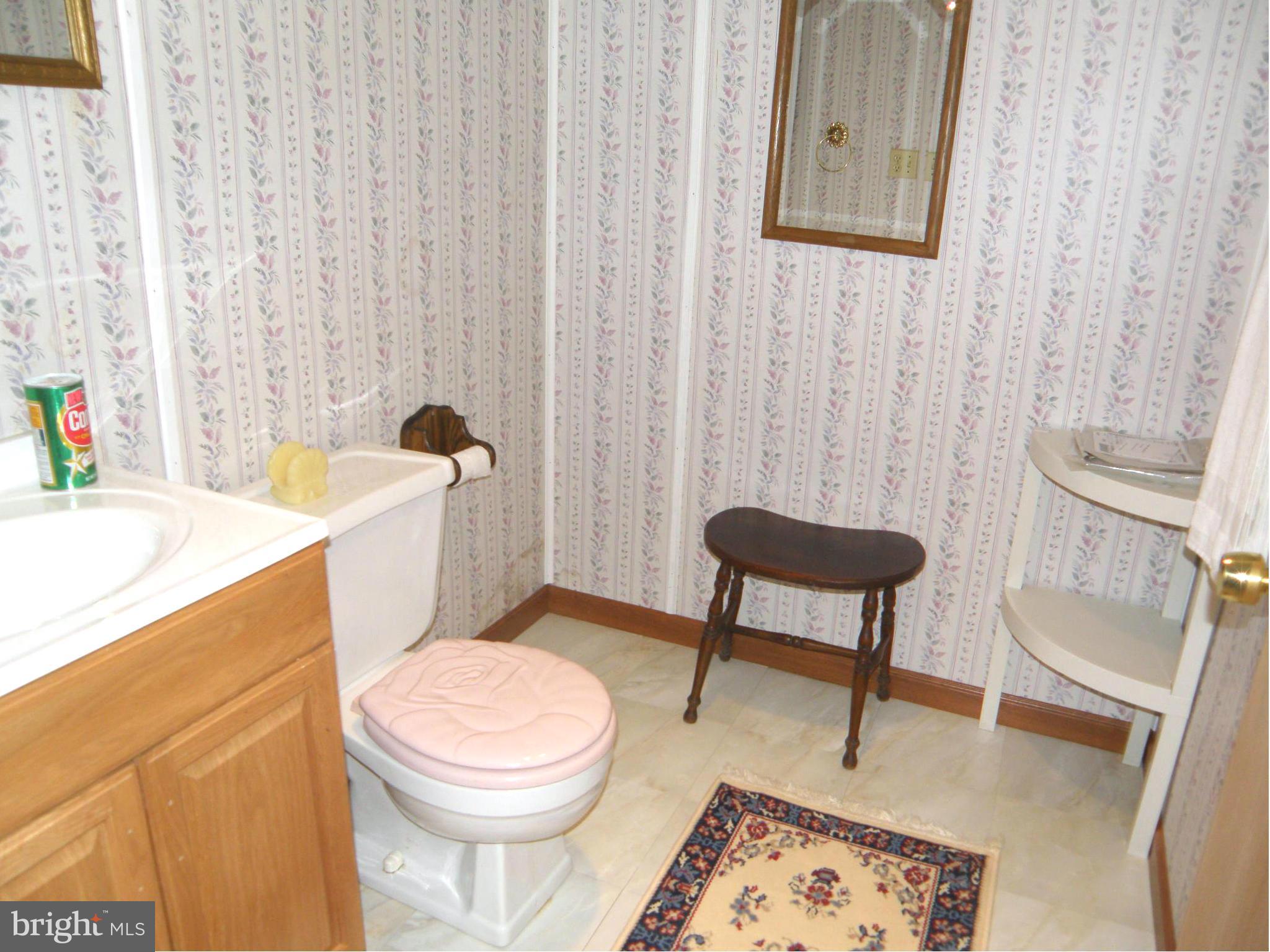 5904 Medora Road Linthicum Heights, MD 21090 - Photo 15 of 20 a bathroom with a toilet a sink and a bathtub
