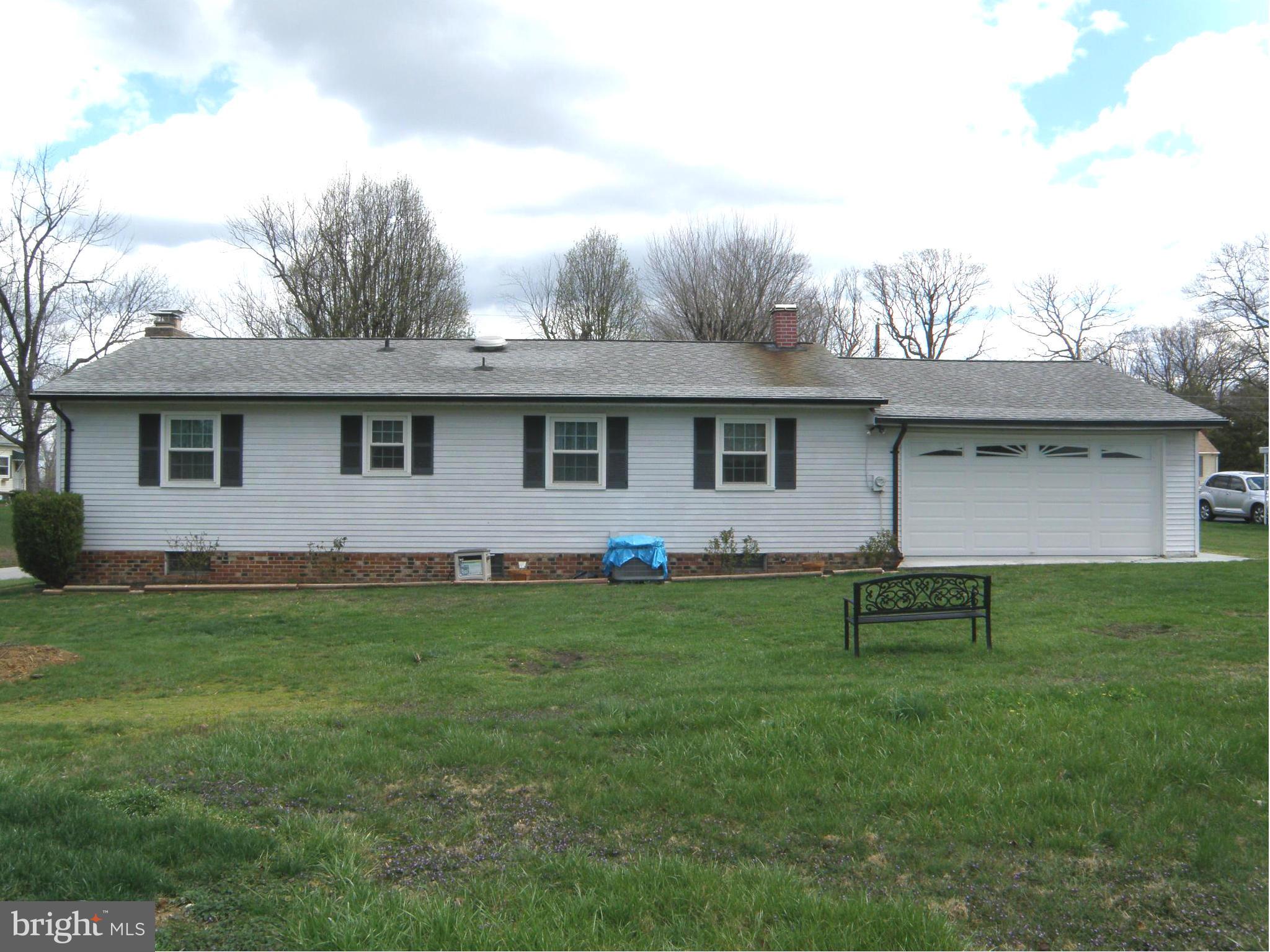 5904 Medora Road Linthicum Heights, MD 21090 - Photo 17 of 20 a front view of a house with a garden