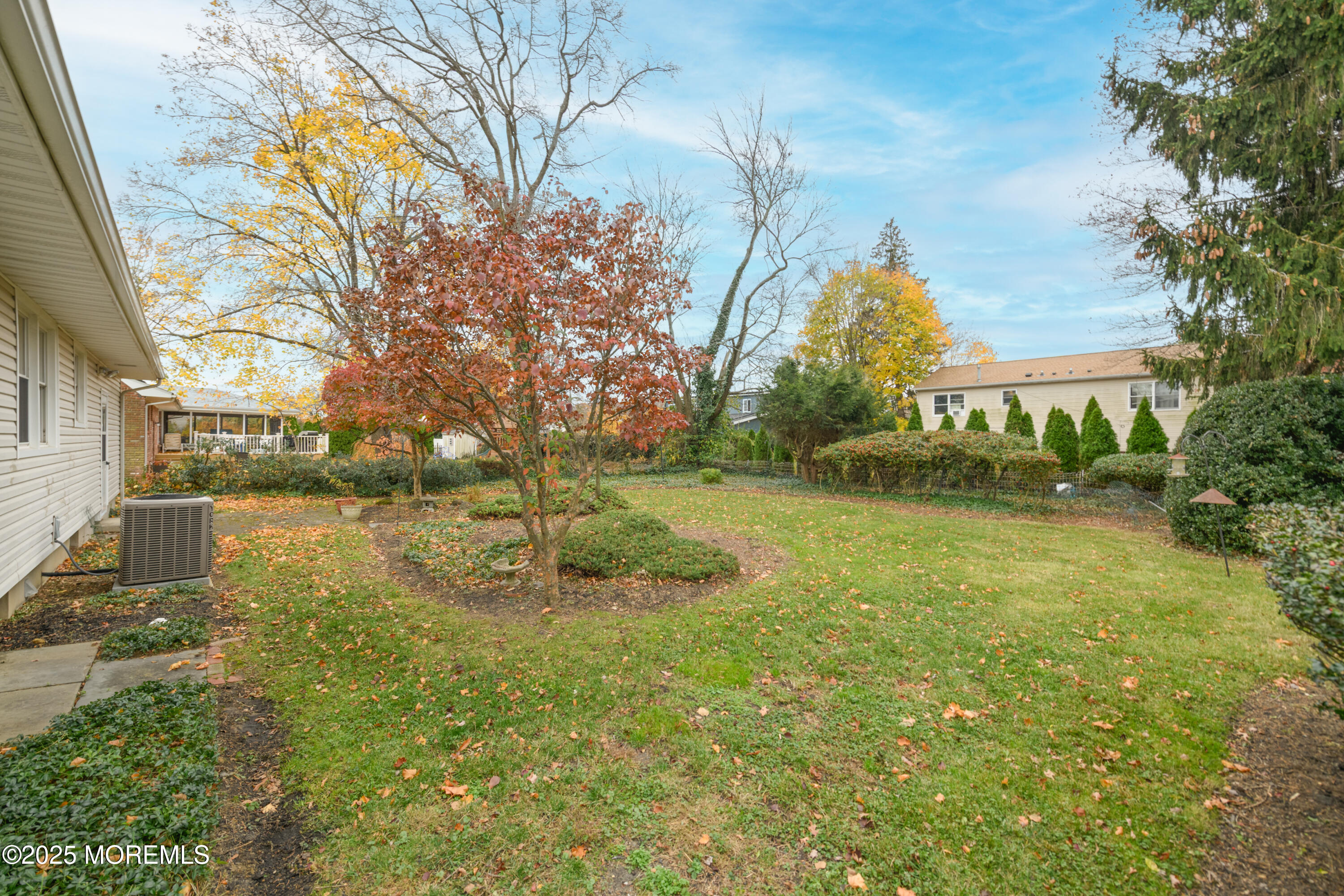 22 Overhill Road Matawan, NJ 07747 - Photo 13 of 27 a view of a yard with plants and large trees