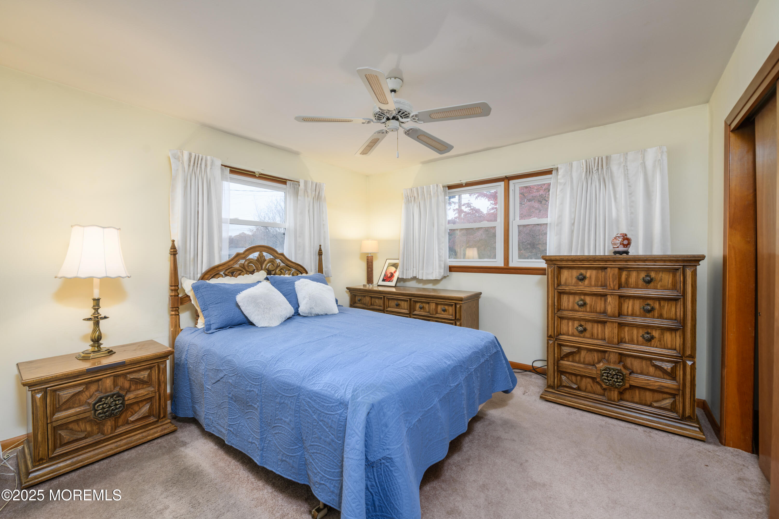 22 Overhill Road Matawan, NJ 07747 - Photo 15 of 27 a bed room with a bed and a chandelier