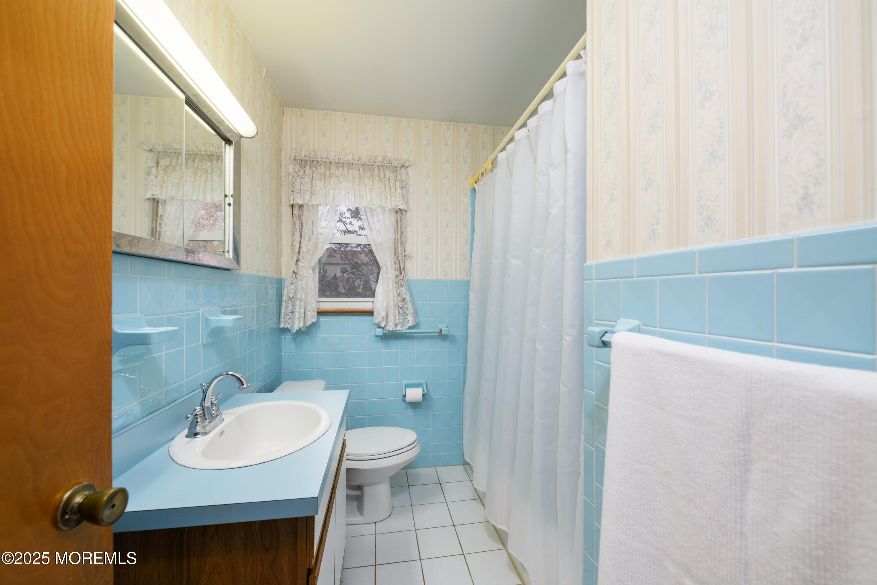 22 Overhill Road Matawan, NJ 07747 - Photo 17 of 27 a bathroom with a sink toilet and mirror