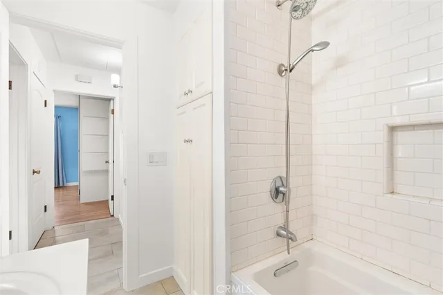 a bathroom with a bathtub and shower