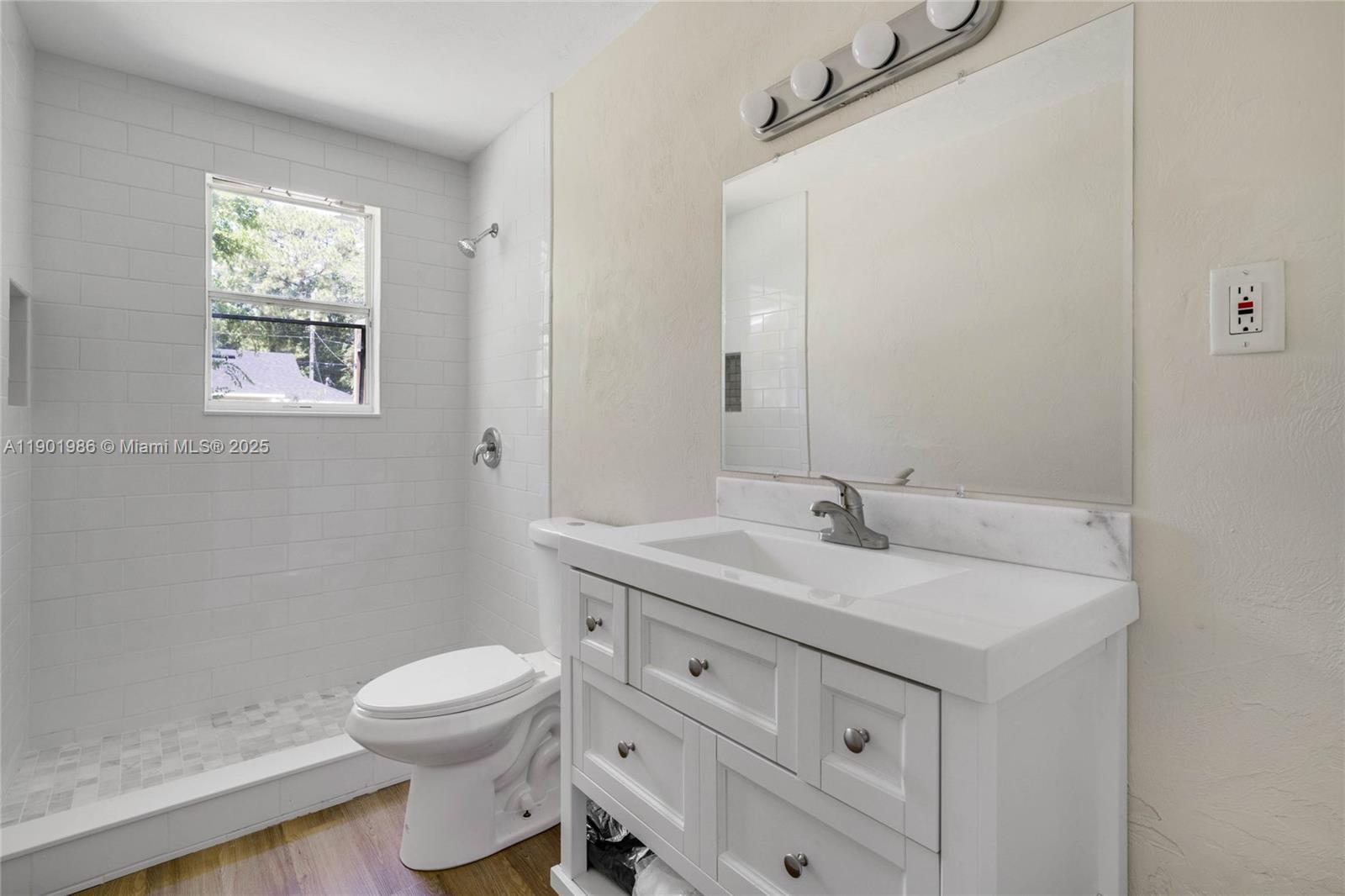 536 Ruth Street Daytona Beach, FL 32114 - Photo 6 of 7 a bathroom with a toilet sink and mirror