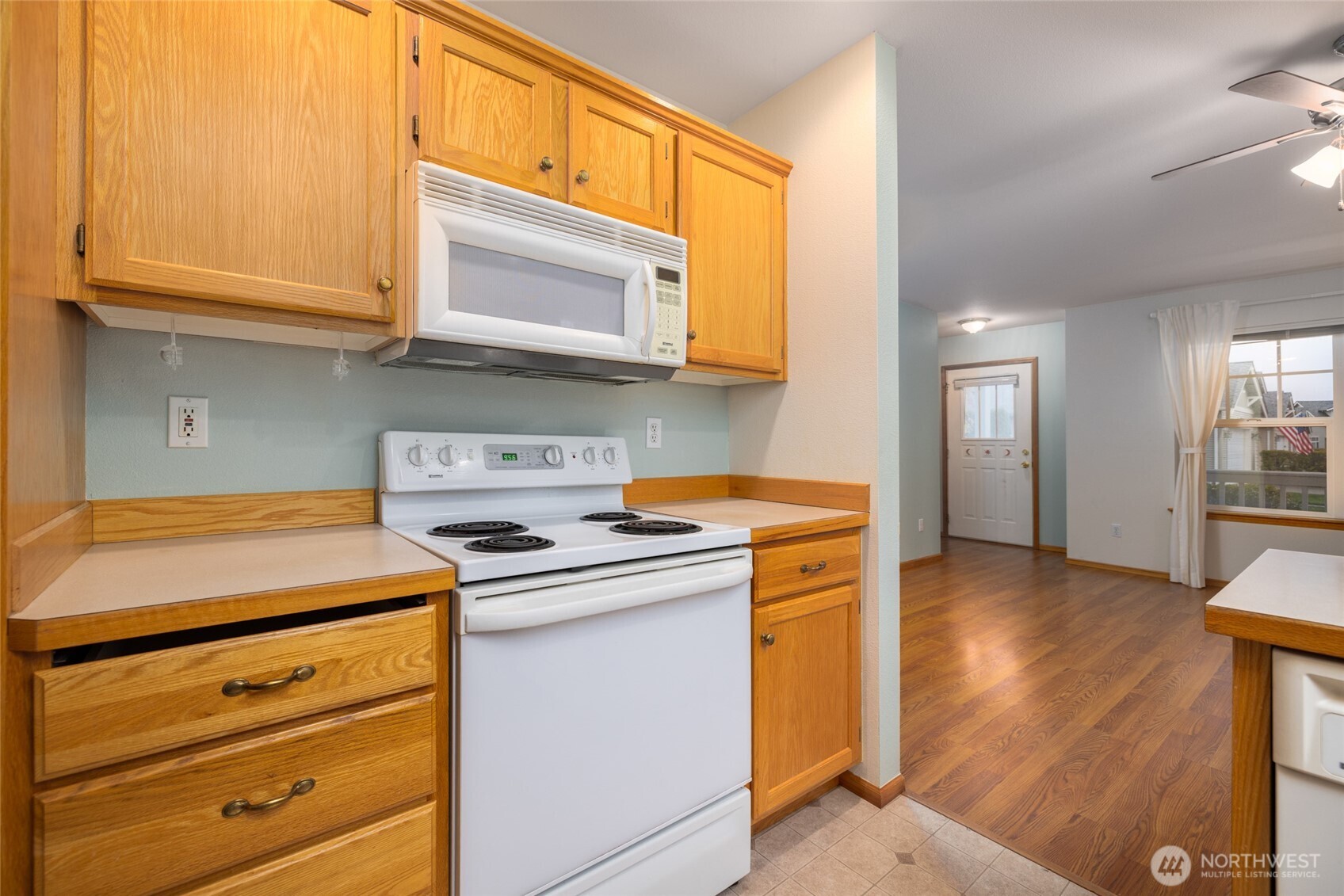 1154 Sinclair Way Burlington, WA 98233 - Photo 11 of 22 a kitchen with stainless steel appliances granite countertop a stove and a microwave