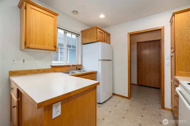 a view of storage and utility room with washer and dryer