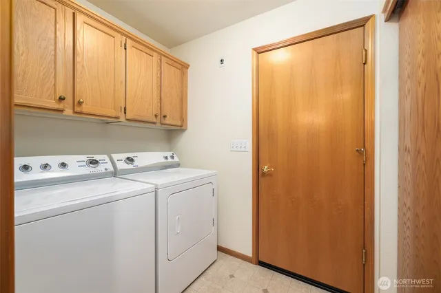 an empty room with entrance and windows