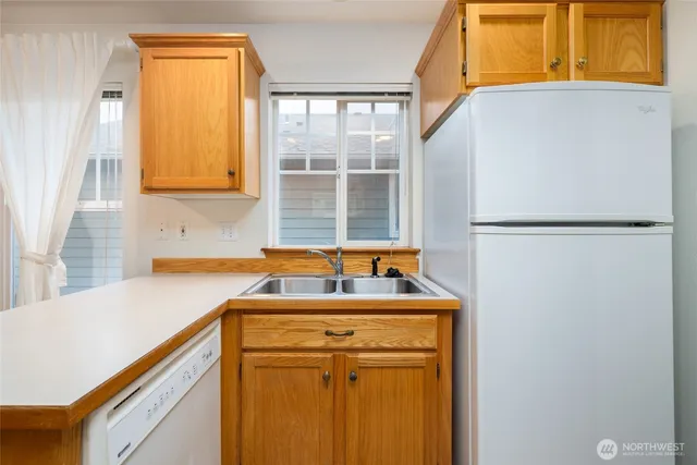 a kitchen with stainless steel appliances granite countertop a stove and a microwave