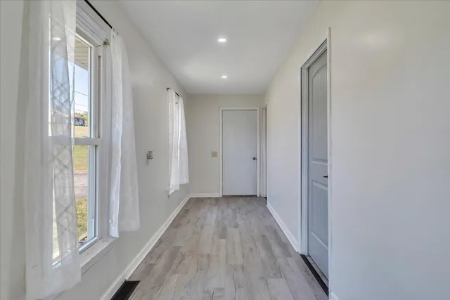 a view of a balcony with wooden floor