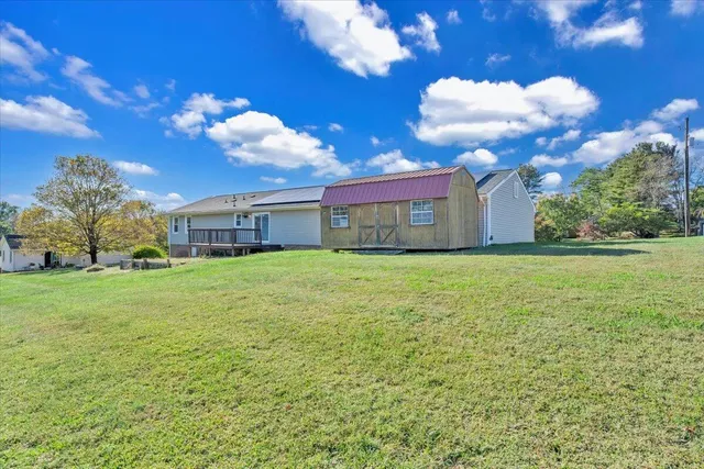a view of a yard with furniture