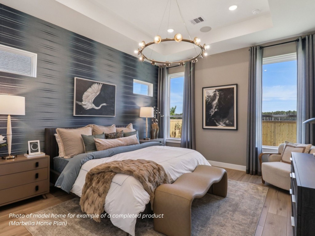 16847 Deep Wingbeat Way Magnolia, TX 77354 - Photo 6 of 16 a bedroom with a large bed and a chandelier