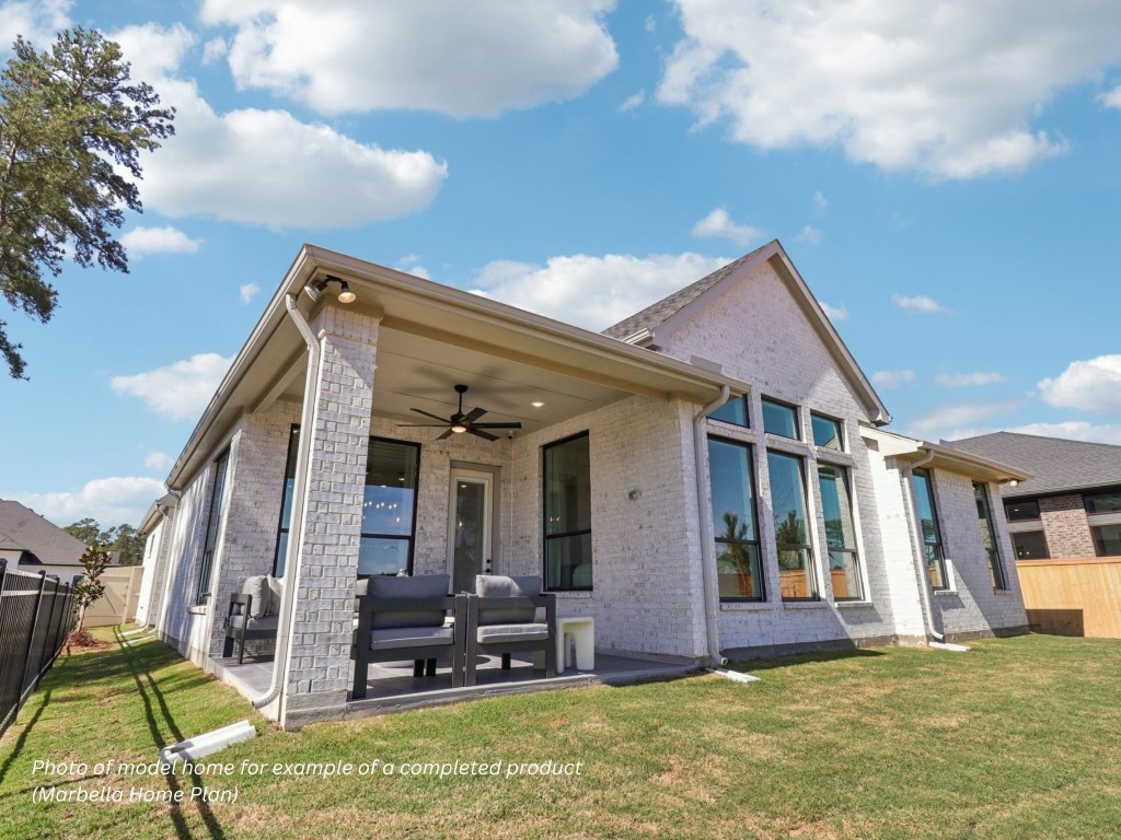 16847 Deep Wingbeat Way Magnolia, TX 77354 - Photo 9 of 16 a view of a house with backyard porch and furniture